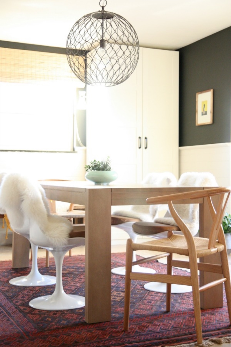 If you're tired of your current dining chairs, but don't want to splurge on replacing the entire set, replace the two that sit at either end for a polished and eclectic vibe. Via House Tweaking